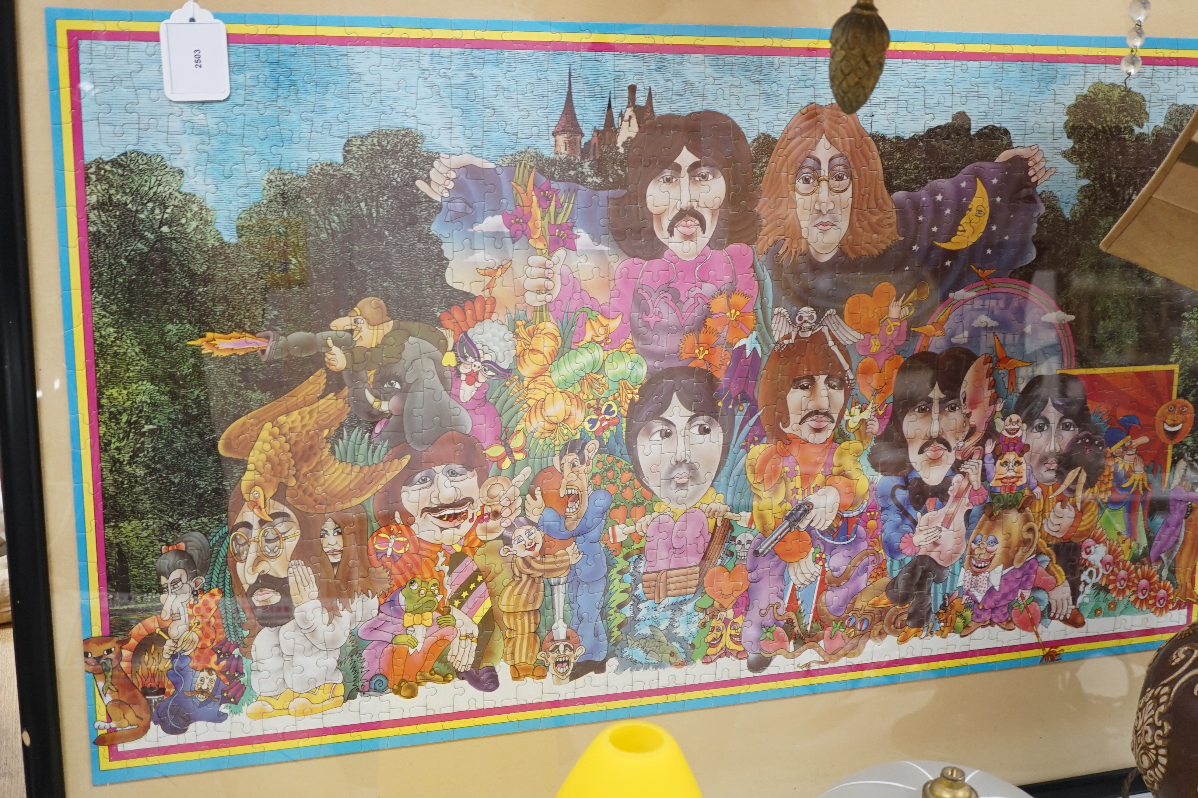 The Beatles Illustrated Lyrics Puzzle in a Puzzle (jigsaw), with colour poster and original box, the puzzle separately framed and glazed